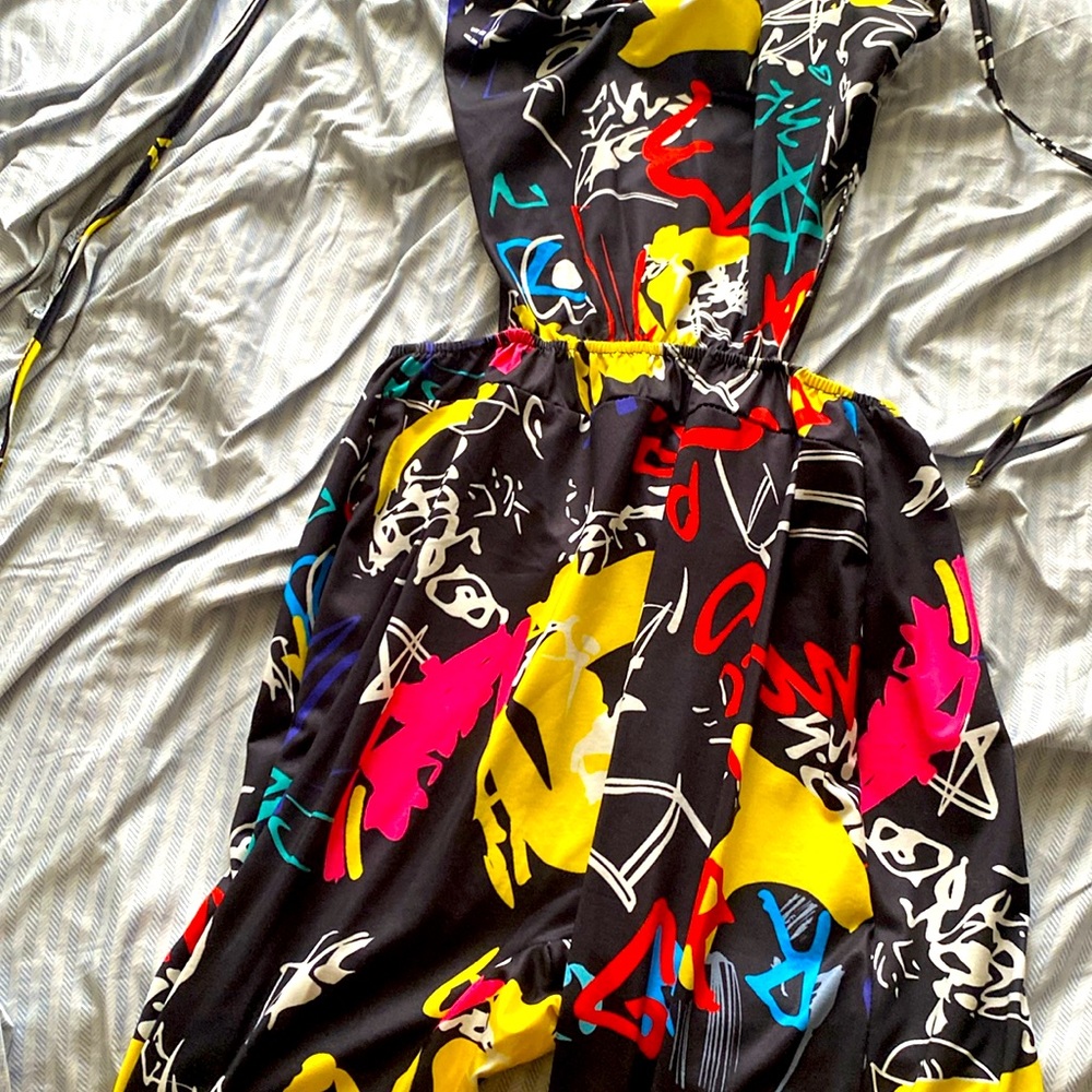 A one piece multicolored red yellow white Blk pink